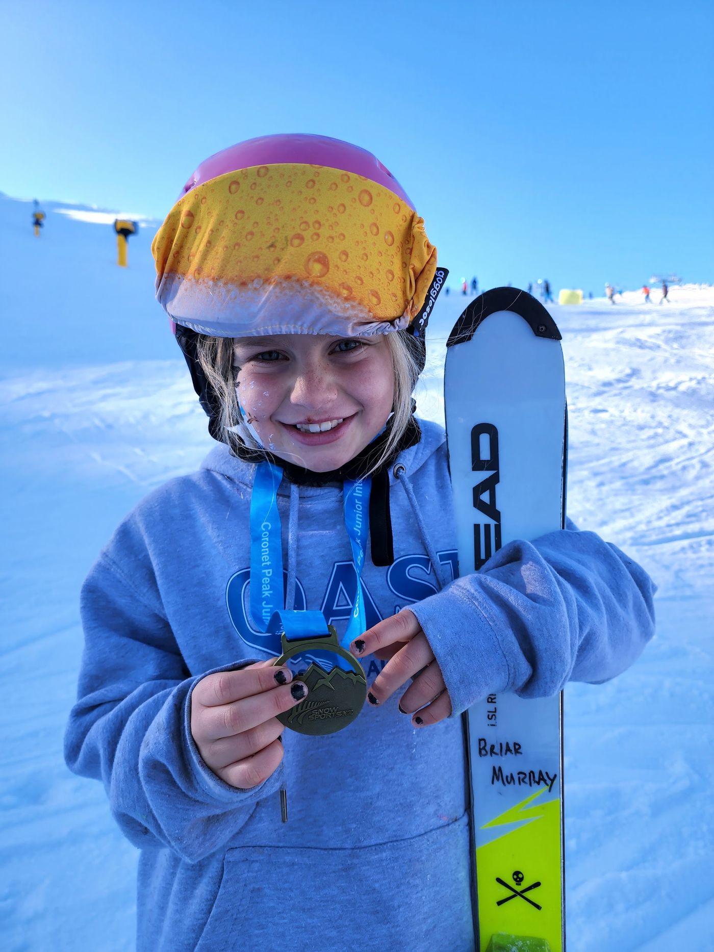 Briar with a medal and her skis